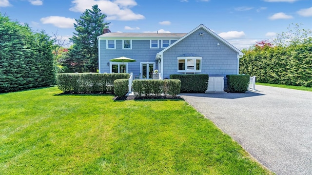 back of house featuring a yard