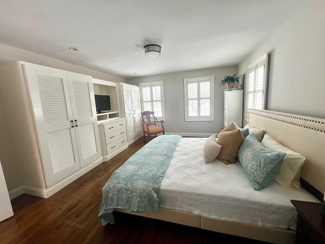 bedroom featuring dark hardwood / wood-style flooring