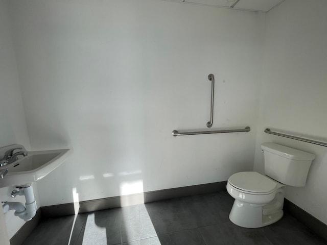 bathroom featuring tile patterned flooring and toilet