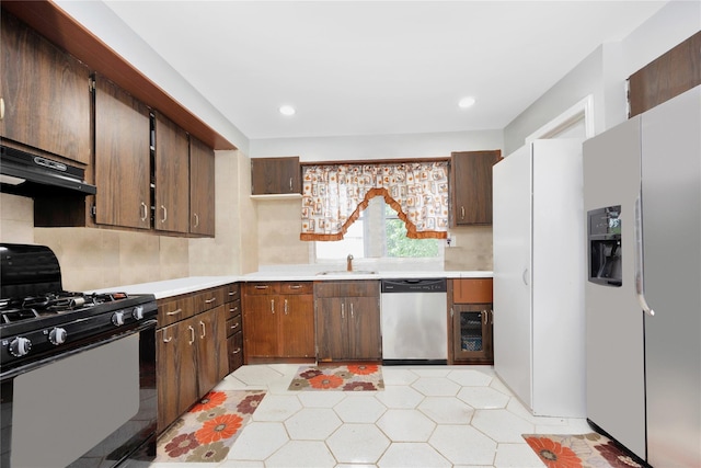 kitchen with sink and appliances with stainless steel finishes