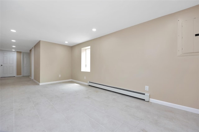 unfurnished room with baseboard heating and electric panel