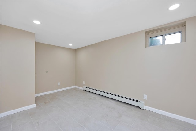 spare room featuring a baseboard heating unit