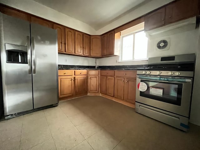 kitchen featuring sink, light tile patterned floors, and appliances with stainless steel finishes