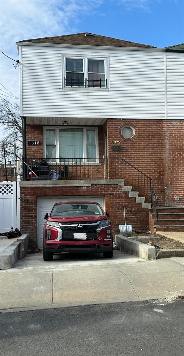 view of front of property with a garage