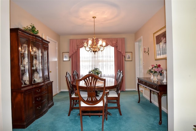 carpeted dining room with an inviting chandelier