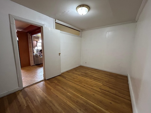 spare room with hardwood / wood-style floors