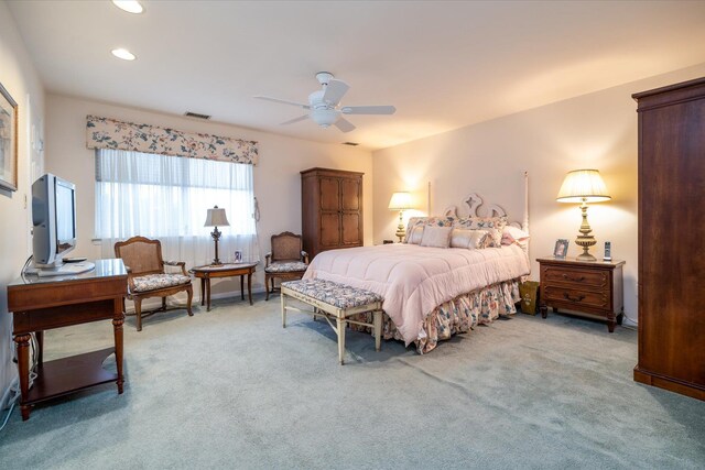 bedroom featuring recessed lighting, a ceiling fan, visible vents, and light carpet