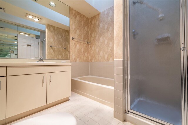 full bath with tile patterned flooring, a garden tub, visible vents, vanity, and a stall shower