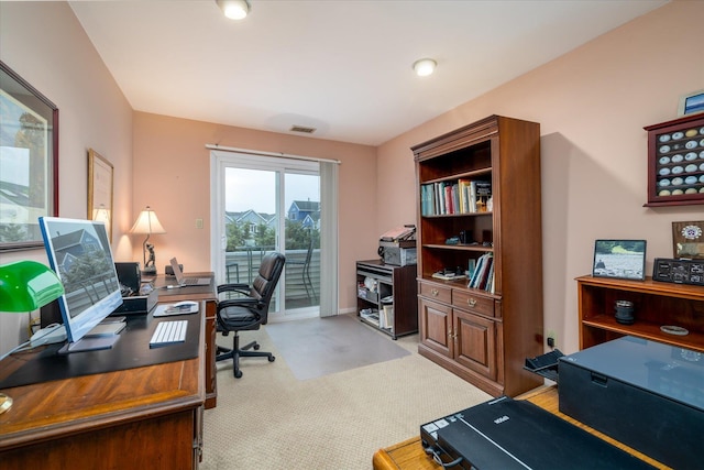carpeted office space featuring visible vents