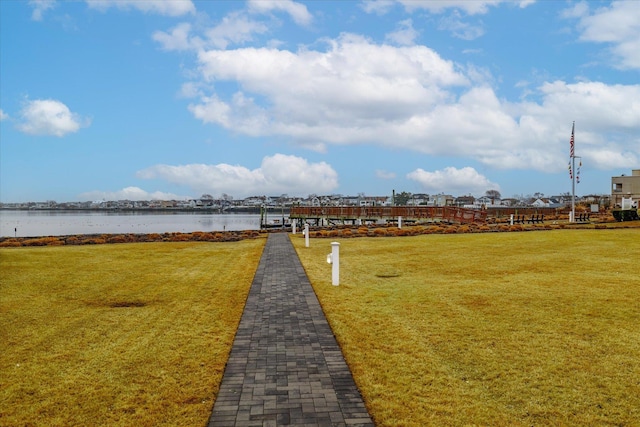 exterior space featuring a water view and a yard