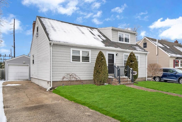 view of front of house featuring an outbuilding, a garage, and a front yard