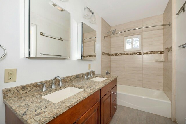 bathroom with double vanity, a sink, and bathing tub / shower combination