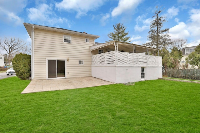 back of house with a yard, fence, and a patio