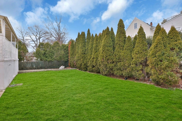 view of yard with fence