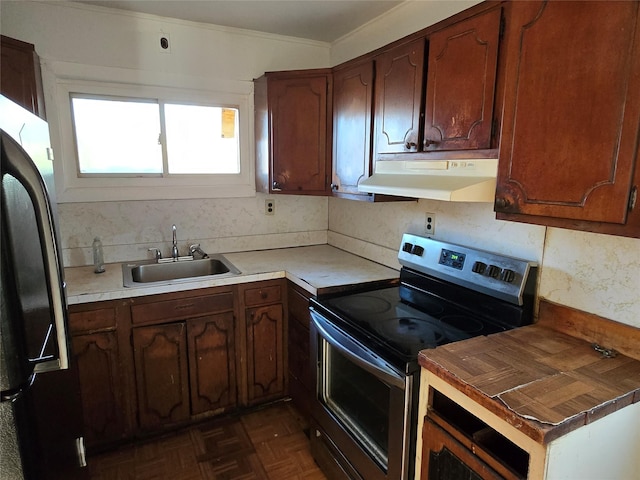 kitchen featuring black fridge, dark parquet floors, sink, and stainless steel range with electric cooktop