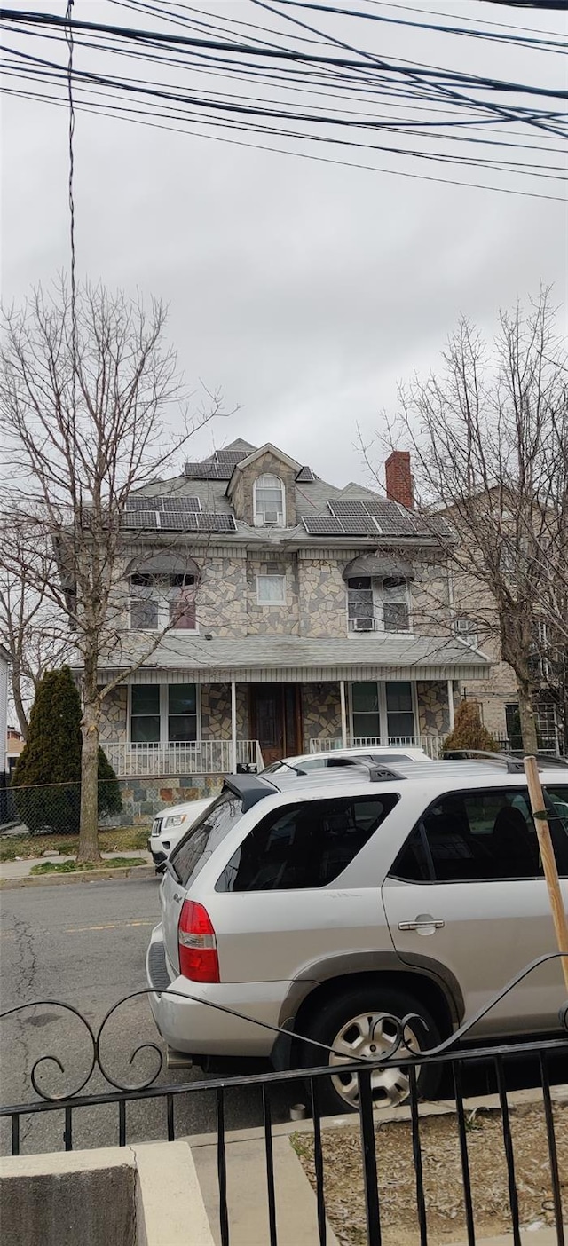 view of front of house featuring a chimney