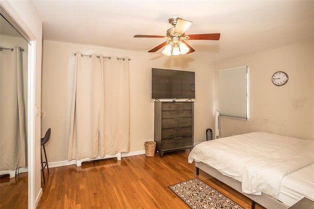 bedroom featuring ceiling fan and wood finished floors