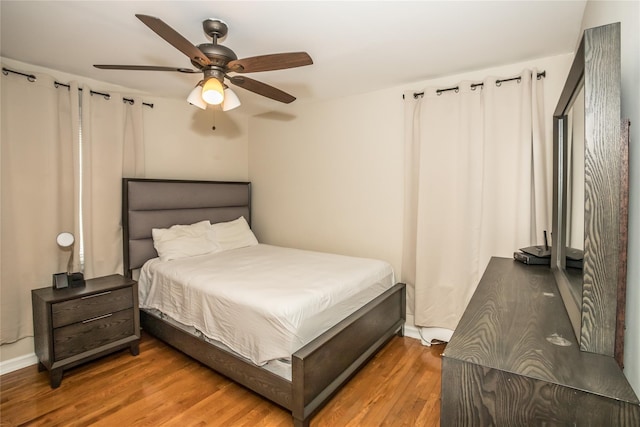 bedroom featuring ceiling fan and wood finished floors