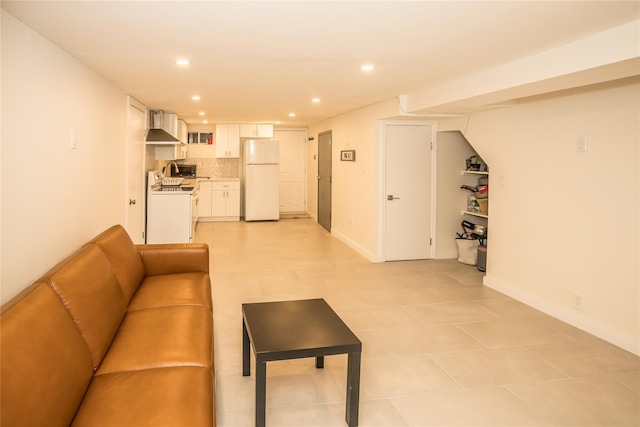 living room with baseboards and recessed lighting