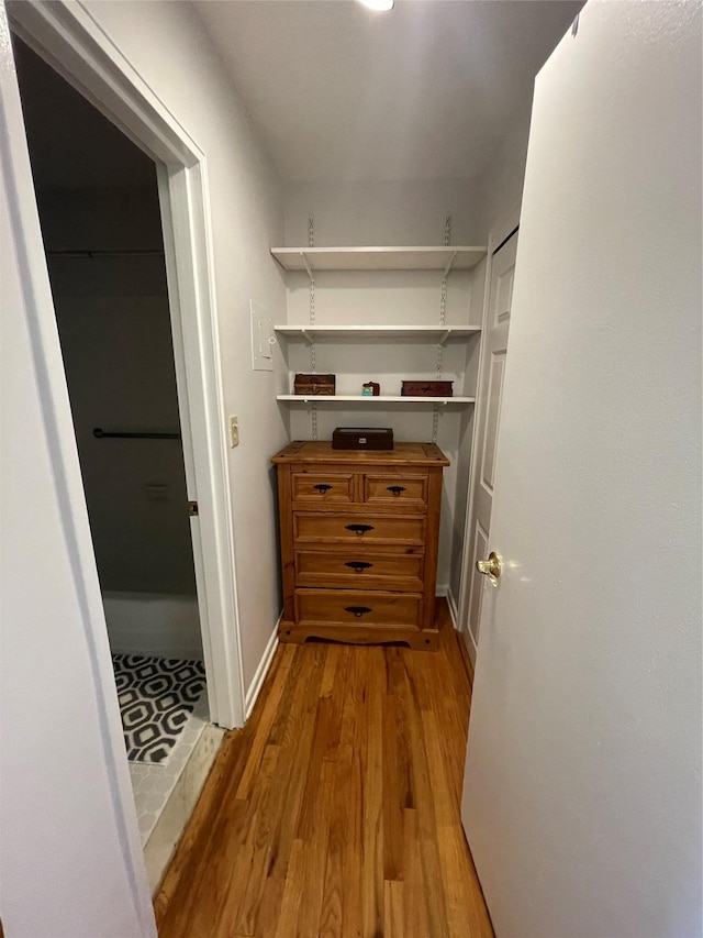 hall with light hardwood / wood-style floors