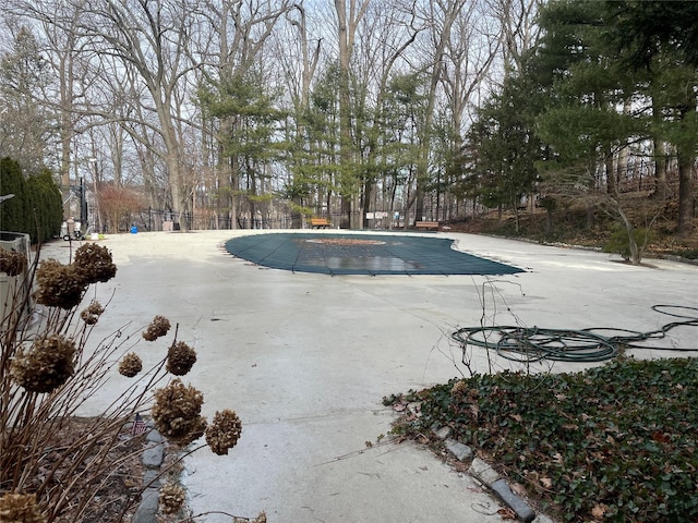 view of swimming pool with a patio