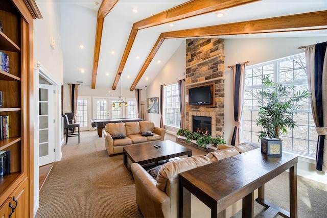 carpeted living area featuring high vaulted ceiling, french doors, a fireplace, and beam ceiling