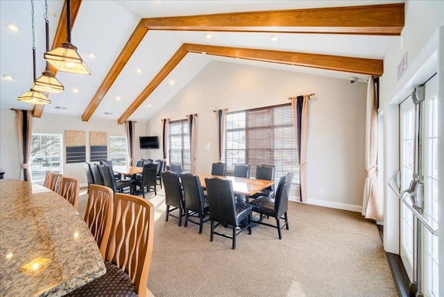 dining space featuring baseboards, visible vents, light colored carpet, high vaulted ceiling, and beam ceiling