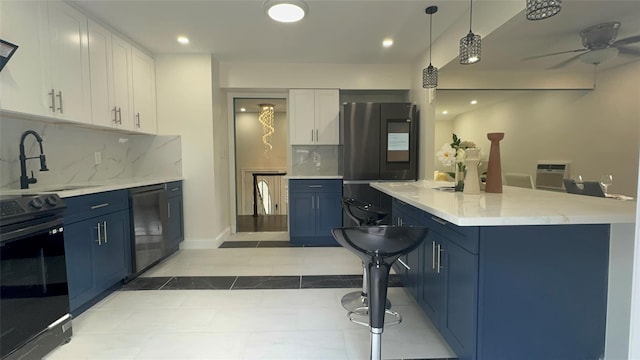 kitchen with range with electric stovetop, white cabinetry, blue cabinetry, and sink