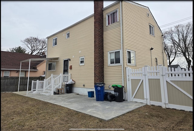 199 Dartmouth St, Hempstead, NY 11550 - back of house featuring a yard and a patio area