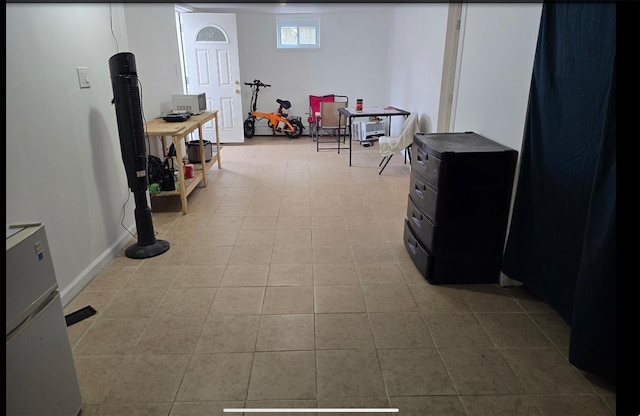 199 Dartmouth St, Hempstead, NY 11550 - interior space with stainless steel fridge and light tile patterned flooring