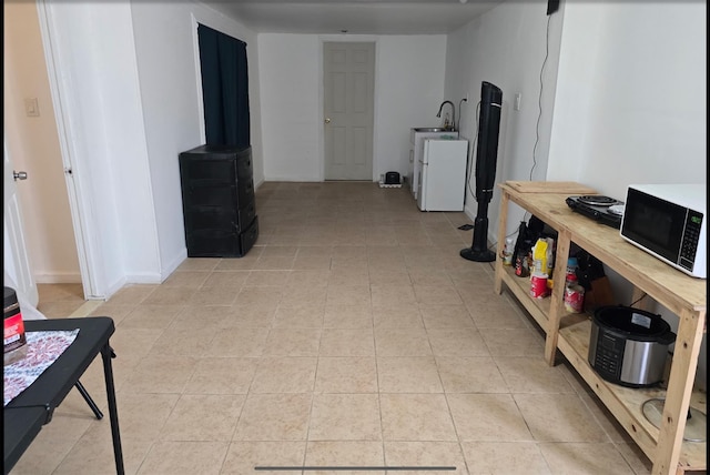 199 Dartmouth St, Hempstead, NY 11550 - hallway with sink and light tile patterned floors