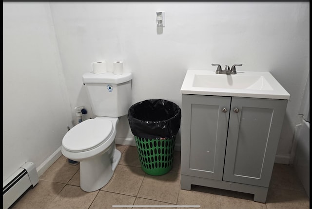 199 Dartmouth St, Hempstead, NY 11550 - bathroom featuring vanity, tile patterned floors, baseboard heating, and toilet