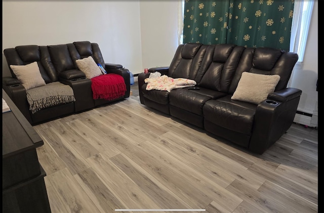 199 Dartmouth St, Hempstead, NY 11550 - living room with a baseboard radiator and light wood-type flooring