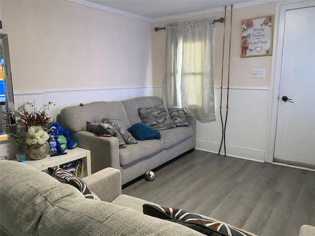 living room with ornamental molding and hardwood / wood-style floors