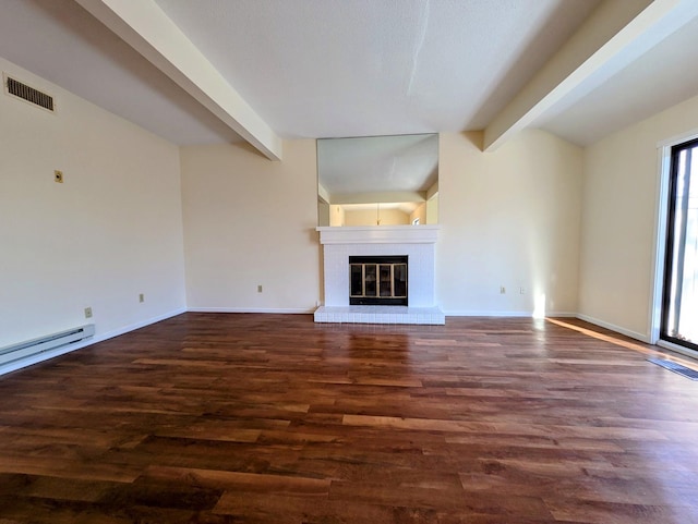 unfurnished living room with lofted ceiling with beams, dark hardwood / wood-style floors, and a fireplace