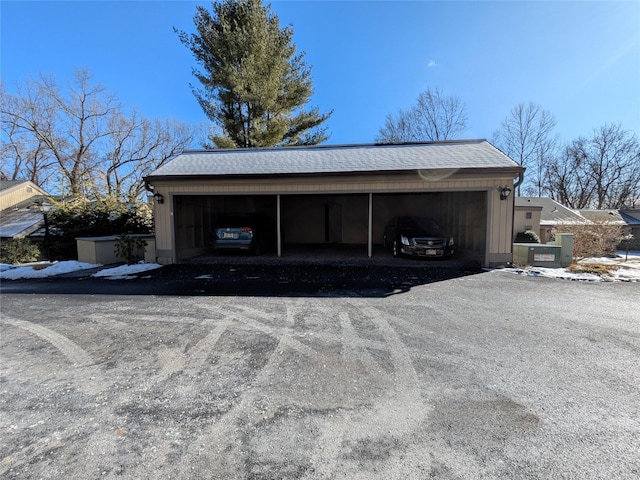 garage featuring a carport