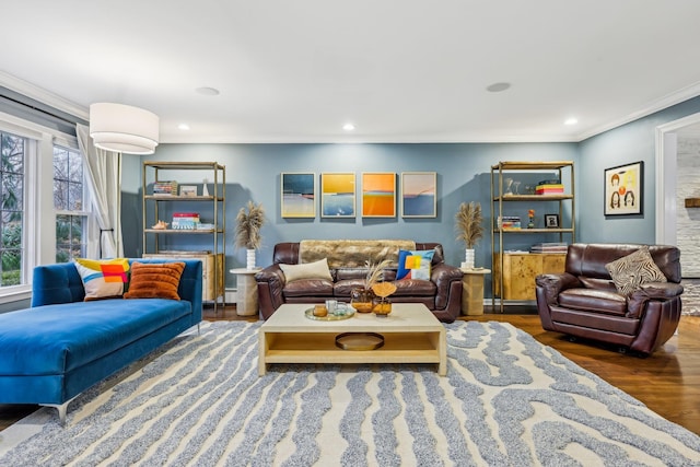 living room with ornamental molding, wood finished floors, and recessed lighting