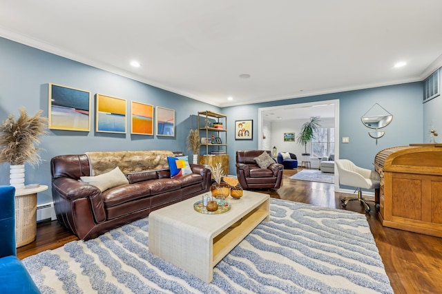 living area featuring recessed lighting, crown molding, baseboard heating, and wood finished floors