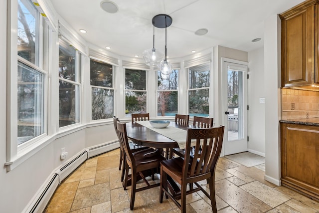 sunroom / solarium featuring a baseboard radiator