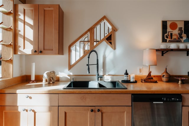 kitchen featuring dishwasher, sink, and light brown cabinets