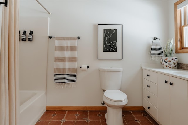 full bathroom featuring vanity, shower / tub combo with curtain, tile patterned floors, and toilet