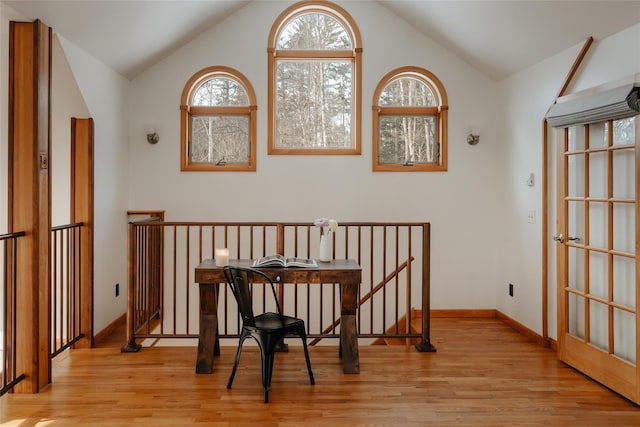 sitting room with vaulted ceiling and light hardwood / wood-style floors