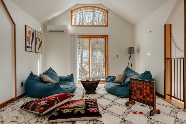 living room with lofted ceiling and a wall mounted AC