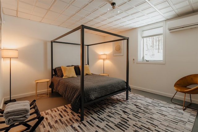 bedroom featuring a wall unit AC