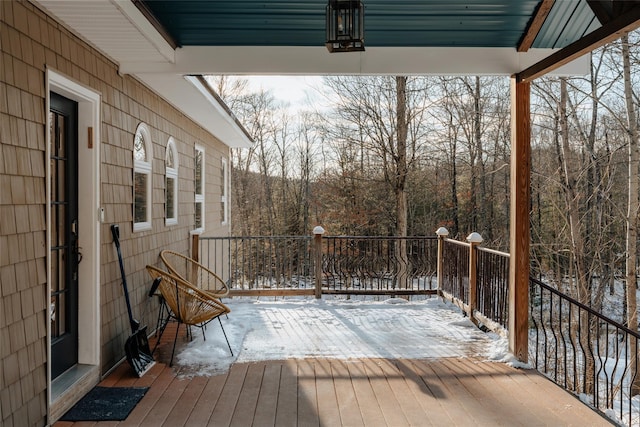 view of snow covered deck