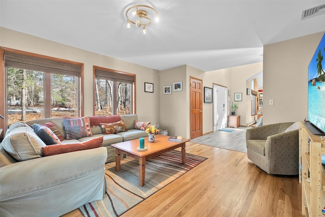 living room with light hardwood / wood-style floors