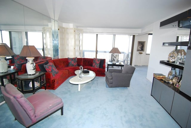 living room featuring carpet floors and a wealth of natural light