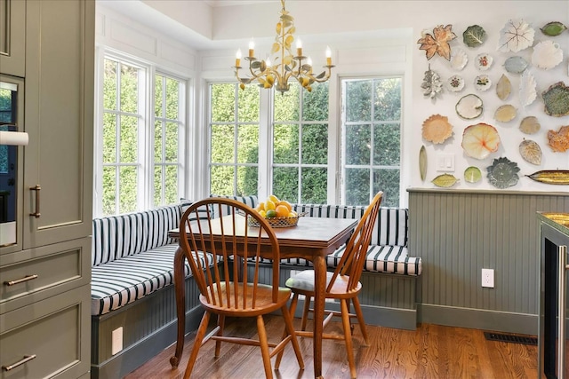 sunroom with a notable chandelier