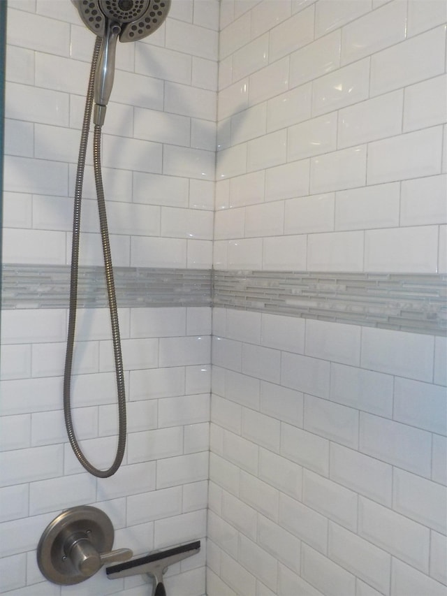 bathroom with tiled shower