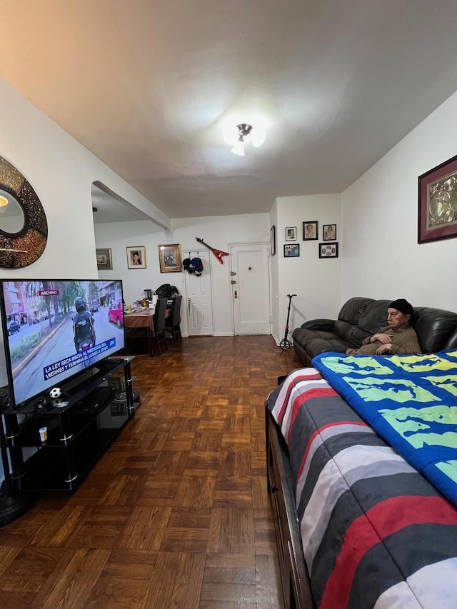 bedroom with dark parquet floors